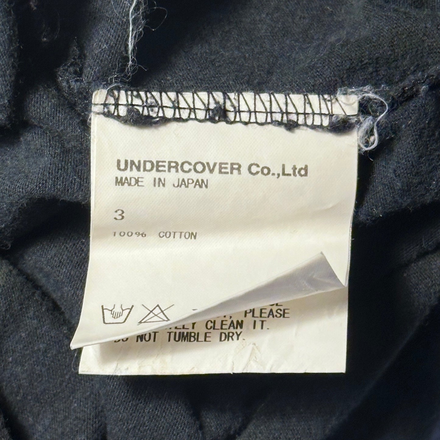 Undercover ‘We are the flowers in your dustbin’ Black Tee
