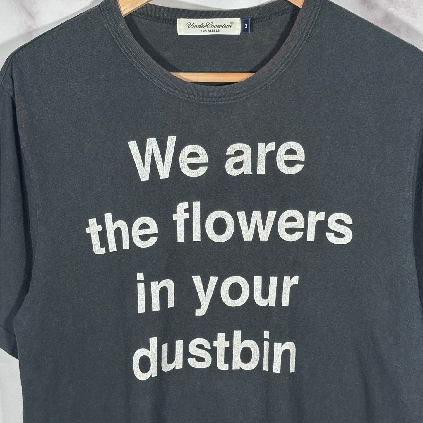 Undercover ‘We are the flowers in your dustbin’ Black Tee
