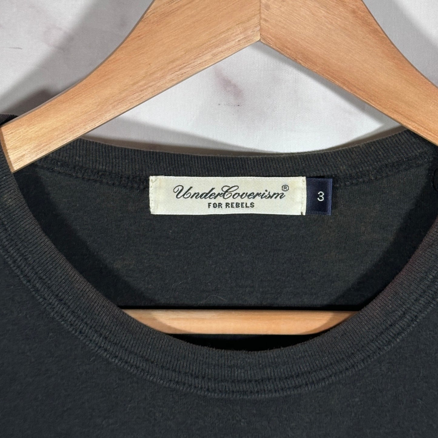 Undercover ‘We are the flowers in your dustbin’ Black Tee