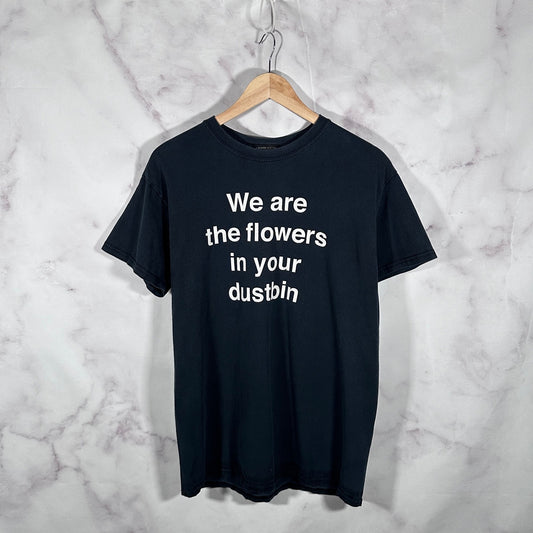 Undercover ‘We are the flowers in your dustbin’ Black Text Tee