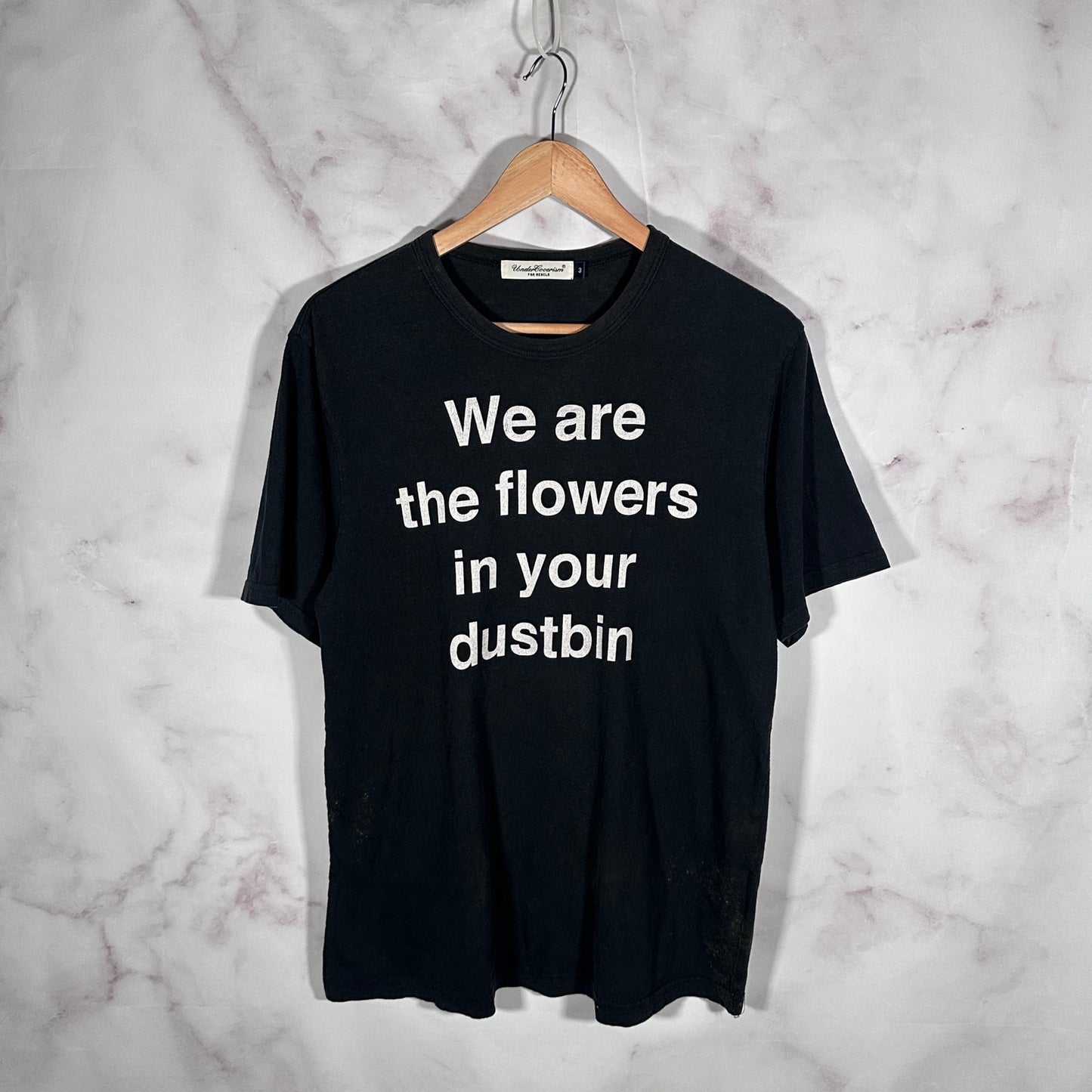 Undercover ‘We are the flowers in your dustbin’ Black Tee